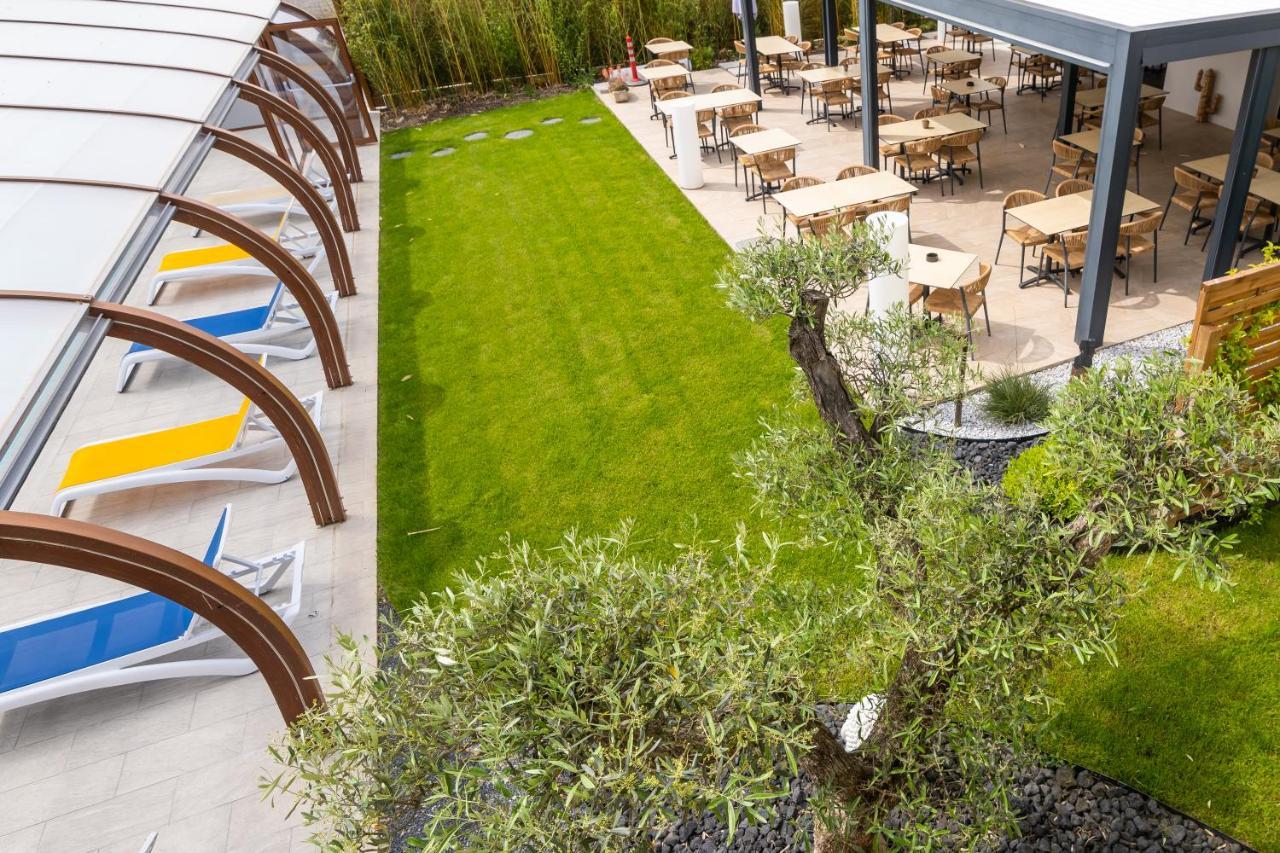 Logis Hotel Restaurant Le Clos Fleuri Кастельнодарі Екстер'єр фото